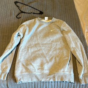Nike sweater size L grey. Advise it as a Medium